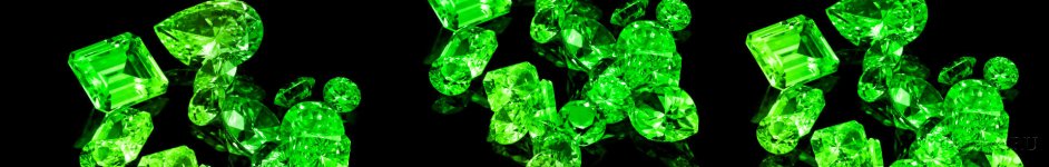 Скинали — Драгоценный камень зеленого цвета на черном фоне