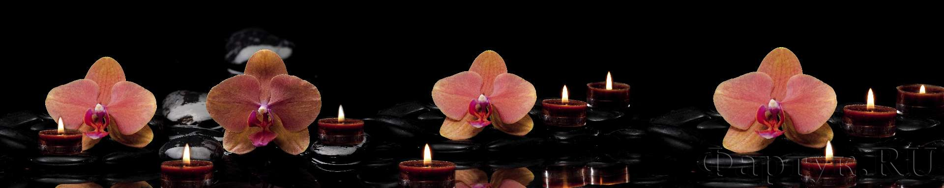 Орхидеи, свечи, камни на темном фоне